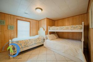 Ένα ή περισσότερα κρεβάτια σε δωμάτιο στο Cg Beach Bungalow #1 +32 φωτογραφίες