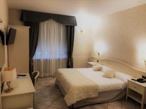 Postel nebo postele na pokoji v ubytování Hotel La Noce