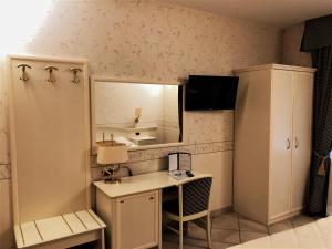 Kuchyň nebo kuchyňský kout v ubytování Hotel La Noce
