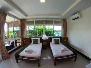 Postel nebo postele na pokoji v ubytování Mountain Resort Koh Lipe