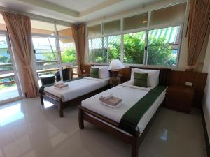 Postel nebo postele na pokoji v ubytování Mountain Resort Koh Lipe