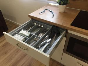 a drawer with utensils in it on a kitchen counter at MAMI / Apto 6 in San Sebastián de la Gomera +5 photos