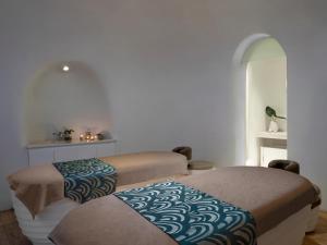 Letto o letti in una camera di JHL Solitaire Gading Serpong