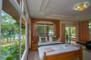 Postel nebo postele na pokoji v ubytování Mountain Resort Koh Lipe + 37 fotografií