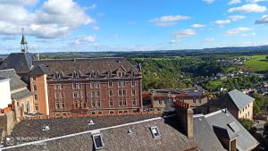 an aerial view of a large brick building at Le Flaugergues in Rodez