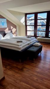 Katil atau katil-katil dalam bilik di Hotel an der Hörn