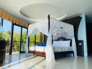 Postel nebo postele na pokoji v ubytování Koh Tao Regal Resort - SHA Plus