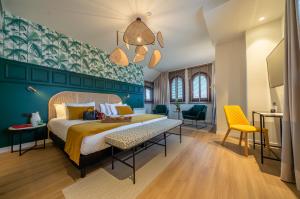 
a bedroom with a large bed and a large window at Puente Colgante Boutique Hotel in Portugalete
