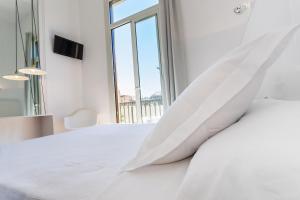 Posteľ alebo postele v izbe v ubytovaní Hostal Argo
