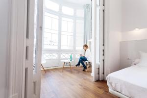 Posteľ alebo postele v izbe v ubytovaní Hostal Argo