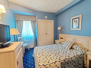 Postel nebo postele na pokoji v ubytování Hotel Leonor Mirón