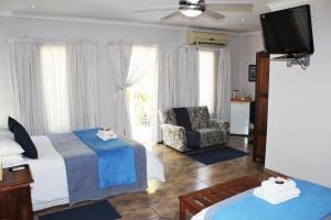 Voodi või voodid majutusasutuse Ngwenya Boutique Hotel toas