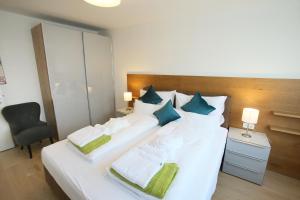 En eller flere senge i et værelse på Seehaus SeeZeit - Am Hafen