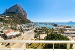 a view from a balcony of a city and a harbor at Hotel Porto Calpe in Calpe