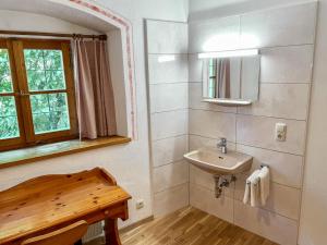 a bathroom with a sink and a mirror at Apartment Burg Biedenegg- Pach by Interhome in Fliess +29 photos