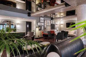 a lobby with chairs and a waiting room at Mercure Hotel Pforzheim in Pforzheim