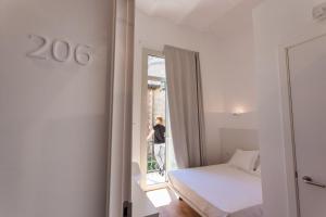 Posteľ alebo postele v izbe v ubytovaní Hostal Argo