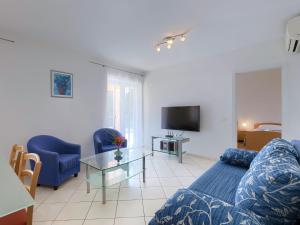 TV a/nebo společenská místnost v ubytování Apartment Macini-4 by Interhome