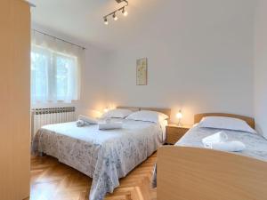 Postel nebo postele na pokoji v ubytování Apartment Macini-4 by Interhome