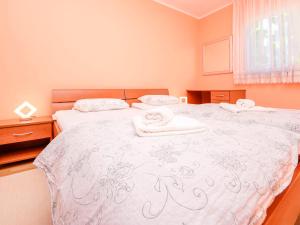 a bedroom with a bed with towels on it at Apartment Nela by Interhome in Starigrad-Paklenica