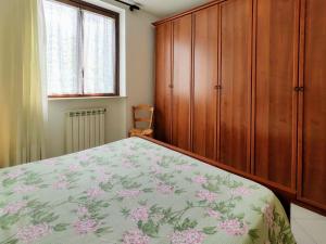 A bed or beds in a room at Apartment Parco Musadino by Interhome