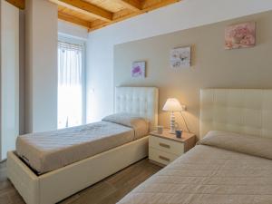 Posteľ alebo postele v izbe v ubytovaní Holiday Home Gelsomini - CCO520 by Interhome
