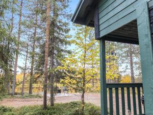 a view from the porch of a cabin with trees at Holiday Home Suvantovirta by Interhome in Kaukonen