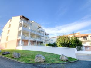 a building with rocks in front of it at Apartment Jardins de Pontaillac-1 by Interhome in Pontaillac