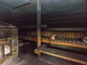 an empty room with a pot sitting on a bench at Holiday Home Honkalinna by Interhome in Kokkosenlahti