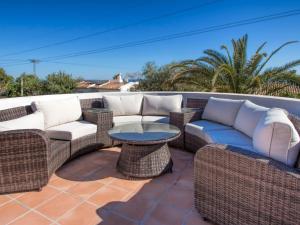 a patio with wicker furniture and a table at Villa Villa del Maestro by Interhome in Altea la Vieja
