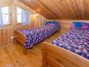 Postel nebo postele na pokoji v ubytování Holiday Home Honkakoli 9 by Interhome