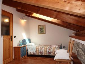 Posteľ alebo postele v izbe v ubytovaní Apartment Maso Marini - Appartamento Volpe by Interhome