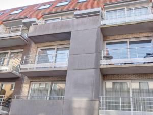 a building with balconies on the side of it at Apartment Residentie Havenhuys-2 by Interhome in Bredene