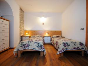 Posteľ alebo postele v izbe v ubytovaní Apartment Maso Marini - Appartamento Capriolo by Interhome