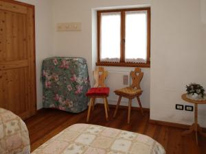 Posteľ alebo postele v izbe v ubytovaní Apartment Maso Marini - Appartamento Capriolo by Interhome