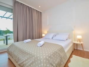 Postel nebo postele na pokoji v ubytování Holiday Home Dalmacia by Interhome