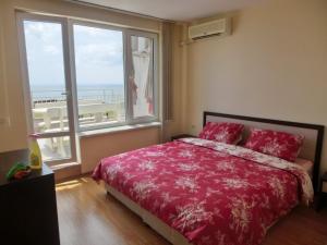A bed or beds in a room at 2 bedroom Imperial apartment with panoramic sea views, Sveti Vlas