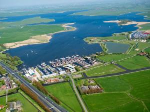 an aerial view of a river and a city at Holiday Home Campi 400 by Interhome in Uitgeest
