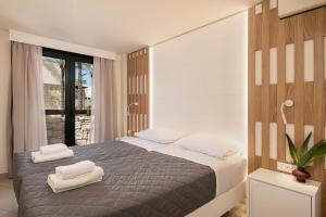 מיטה או מיטות בחדר ב-Elia Platanias