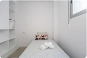 En eller flere senge i et værelse på Islas Canarias Apartment