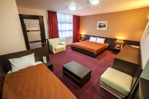 Ένα ή περισσότερα κρεβάτια σε δωμάτιο στο Hotel Terminus