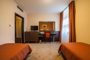 Ένα ή περισσότερα κρεβάτια σε δωμάτιο στο Hotel Terminus