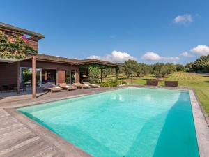 a swimming pool in the backyard of a house at Holiday Home Villa Lavezzi by Interhome in Bonifacio