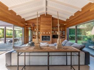 a living room with a table and a couch at Holiday Home Villa Lavezzi by Interhome in Bonifacio +39 photos