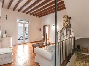 a living room with a white couch and a table at Holiday Home Robin by Interhome in Sa Pobla