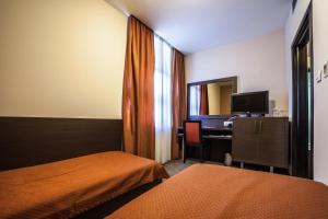 Ένα ή περισσότερα κρεβάτια σε δωμάτιο στο Hotel Terminus