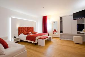 Un ou plusieurs lits dans un hébergement de l'établissement Hotel Marco Polo