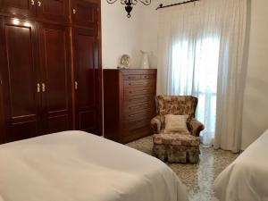 Postel nebo postele na pokoji v ubytování Casa Los Molineros