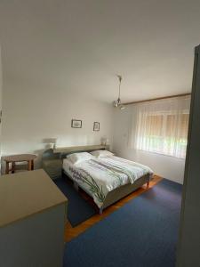 Posteľ alebo postele v izbe v ubytovaní Apartmani Pavat