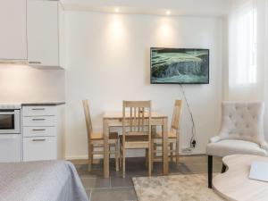 a kitchen and dining room with a table and chairs at Holiday Home Skistar 315 by Interhome in Sirkka